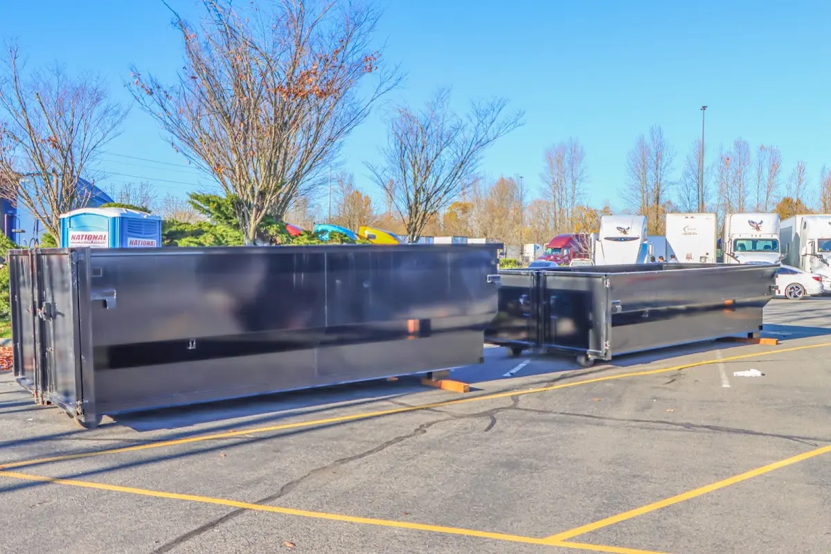 Professional dumpster rental service with roll-off container on residential driveway in Southlake